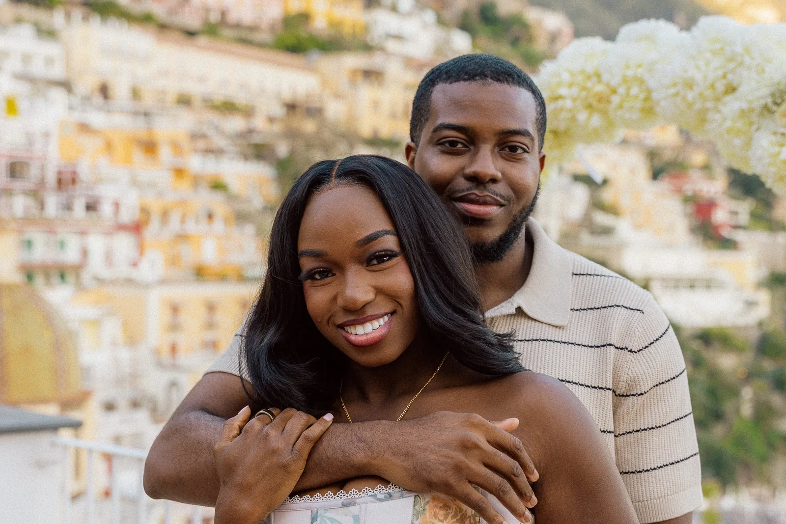 Eniola and Uchenna embracing together at their Positano proposal